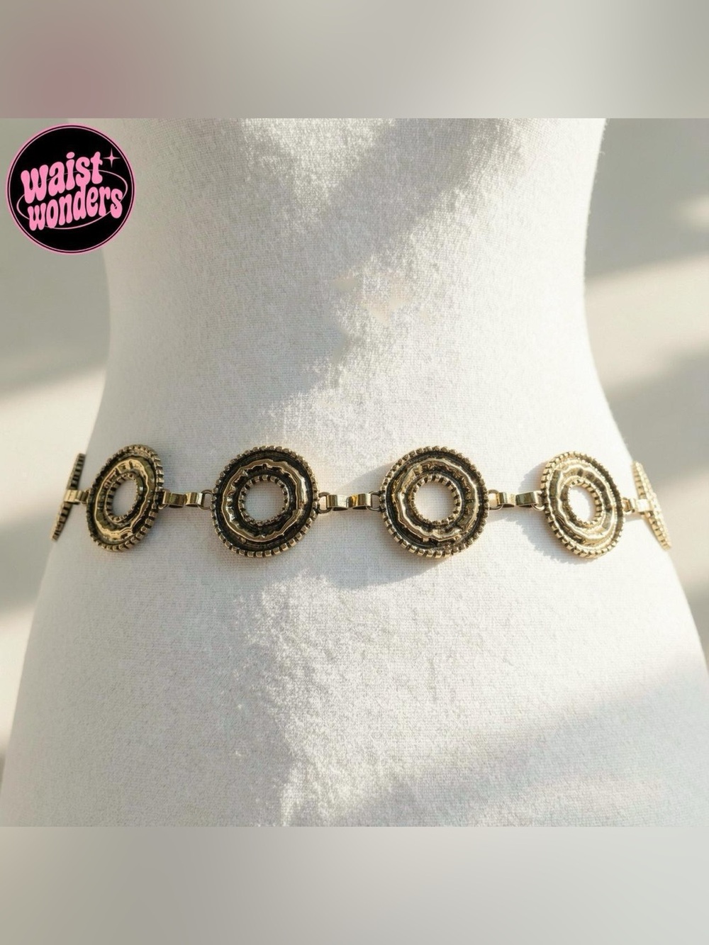Gold tone metal belt with brass chain, metal circles and metal ball details